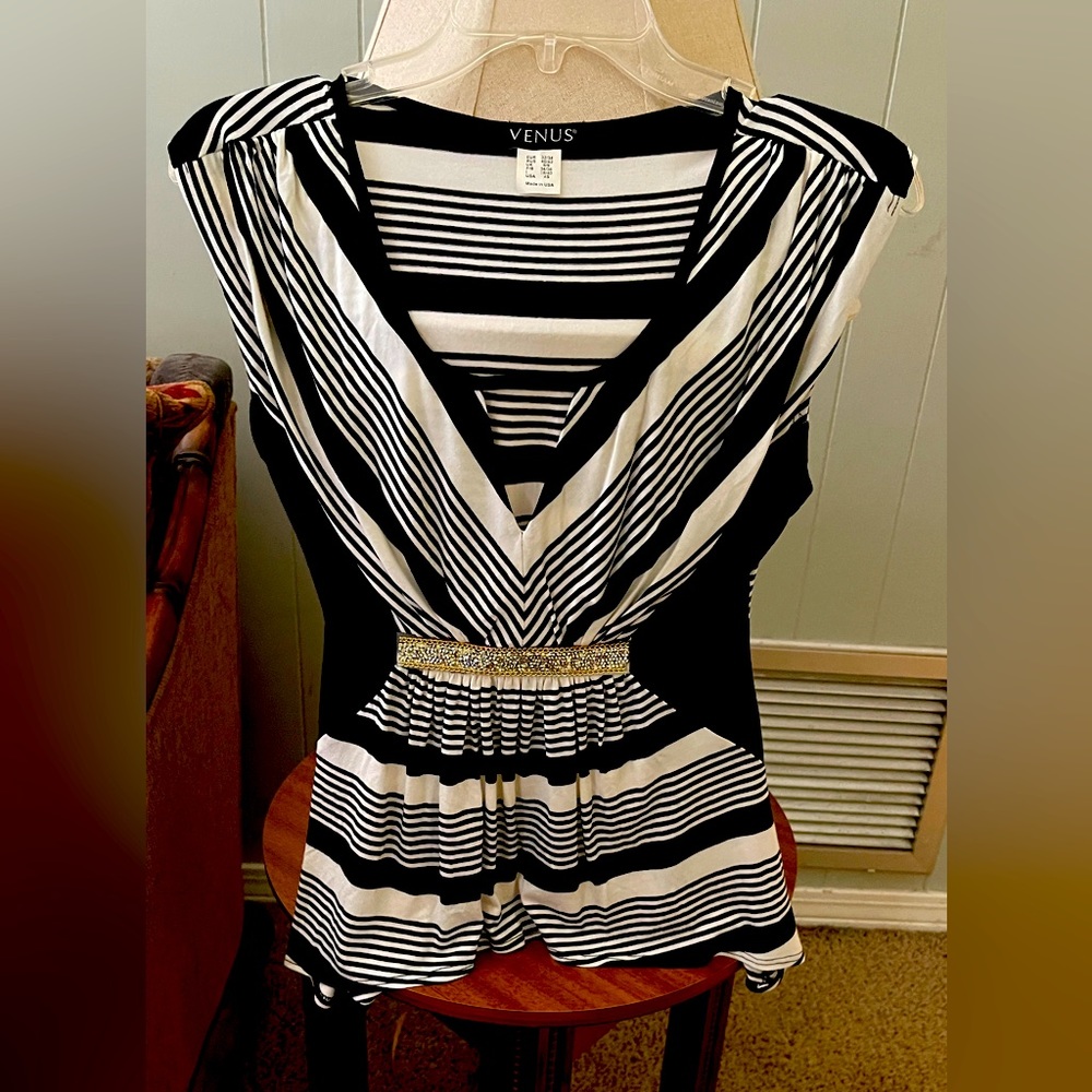 Venus knit top. In excellent condition. Black and white. sequined trim at waist
